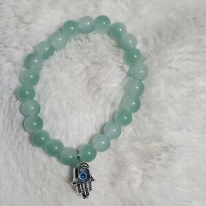 Green Beaded Bracelet with Silver Charm